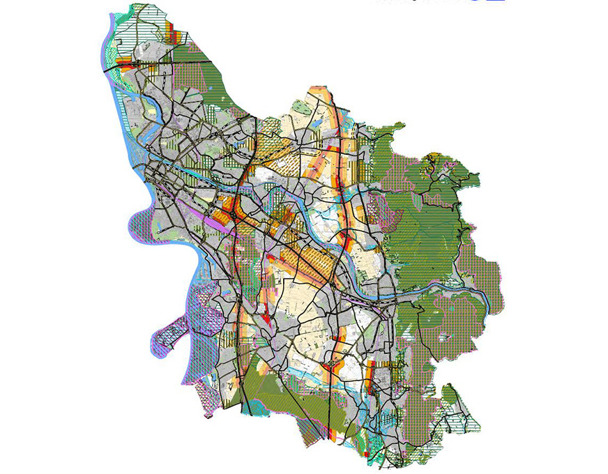 Übersichtskarte Windenergie und Photovoltaik Bunte Stadtkarte mit Straßen, Nutzungszonen und markierten Flächen für Wind- und Solarenergie.